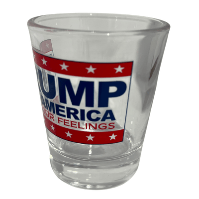 Trump F Your Feelings shot glass featuring a clear design, bold 'TRUMP FOR AMERICA' text, and 'F * YOUR FEELINGS' slogan against red and white stripes.