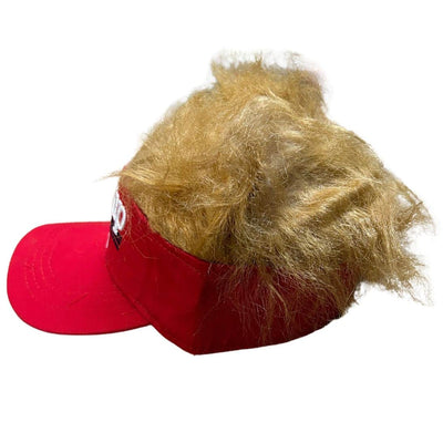 Trump Hair Visor featuring 'Trump 2024' in white lettering on red background, with lifelike golden hair attached to the back.