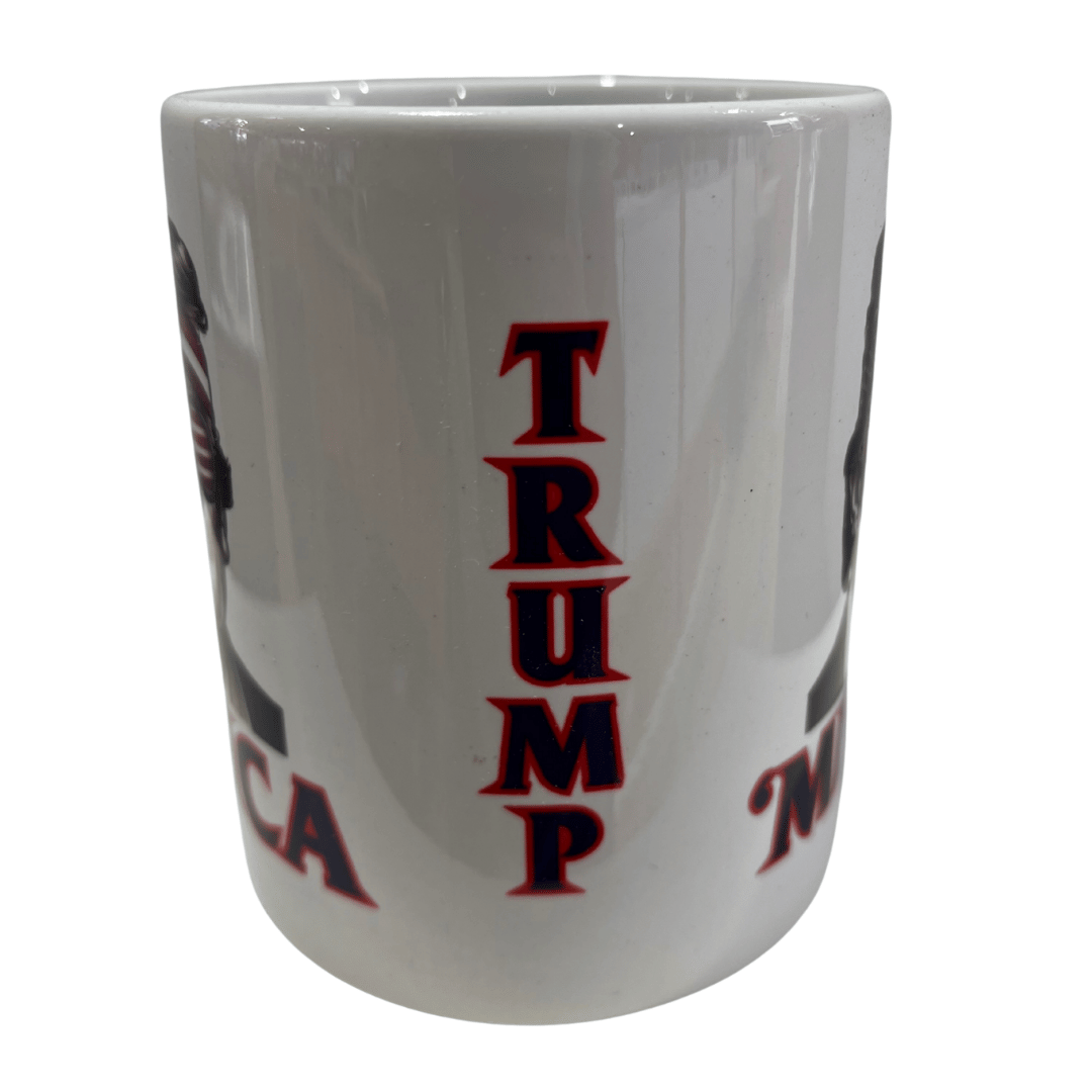 A Trump 'Merica Shades Mug showcases Donald Trump with American flag sunglasses and a stars-and-stripes bandana, capturing patriotic spirit.