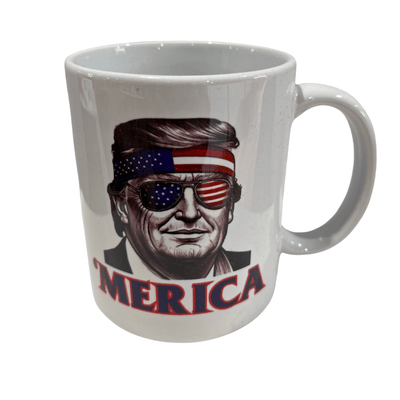 A Trump 'Merica Shades Mug showcases Donald Trump with American flag sunglasses and a stars-and-stripes bandana, capturing patriotic spirit.