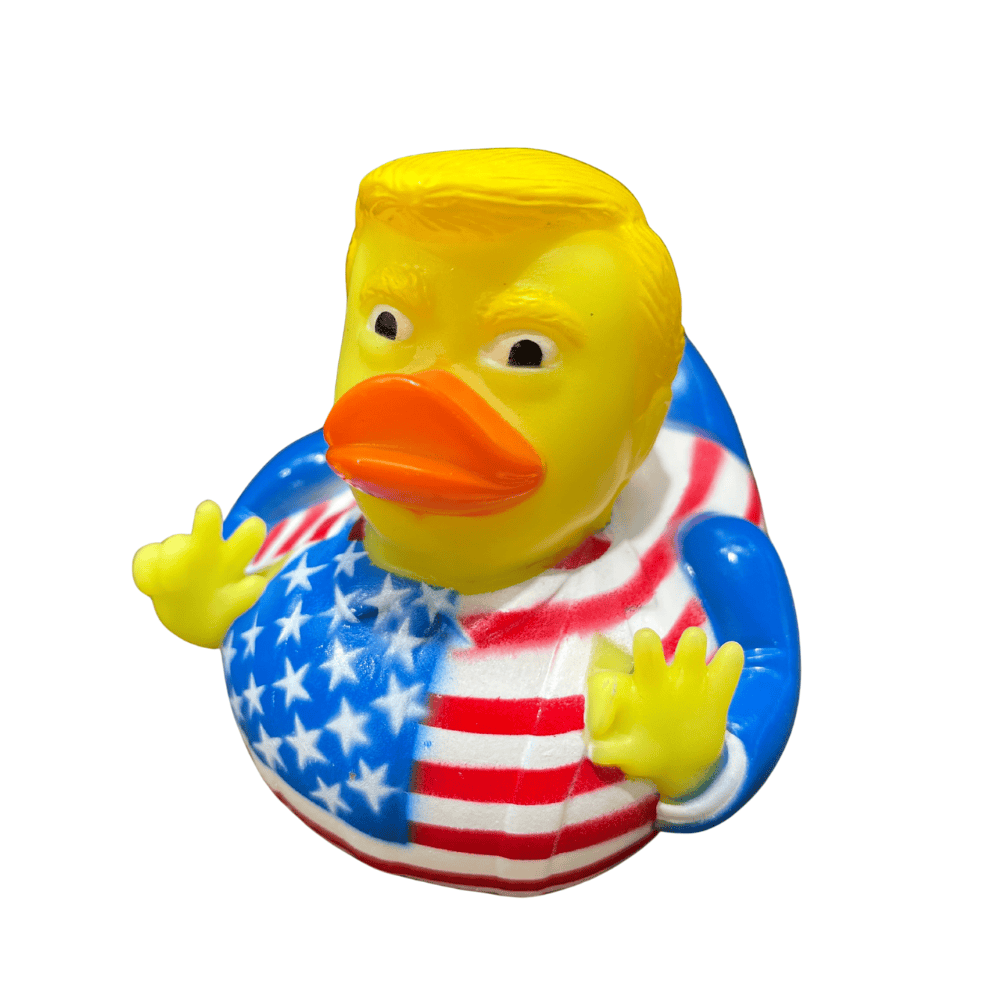 Trump Patriot Ducky featuring bright American flag design and confident expression displayed on a desk in an office environment.