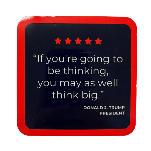 Trump Think Big Coaster displaying a motivational quote with deep navy background, white text, and red stars on a coffee table.