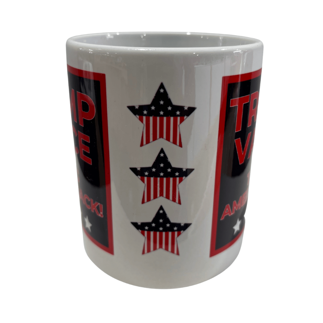 Trump Vance 2024 'Taking America Back!' Mug featuring bold red text and stars displayed on a kitchen table with coffee inside.