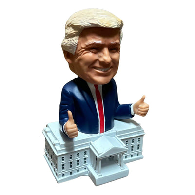 Trump White House Bobblehead showing a smiling Donald Trump with two thumbs up on a detailed White House base, showcasing vibrant hand-painted craftsmanship.