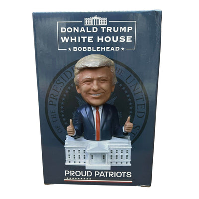 Trump White House Bobblehead showing a smiling Donald Trump with two thumbs up on a detailed White House base, showcasing vibrant hand-painted craftsmanship.
