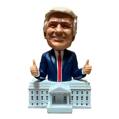 Trump White House Bobblehead showing a smiling Donald Trump with two thumbs up on a detailed White House base, showcasing vibrant hand-painted craftsmanship.