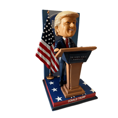 Trump White House Press Conference Bobblehead featuring Donald Trump mid-speech behind a replica podium with microphones and the White House emblem.
