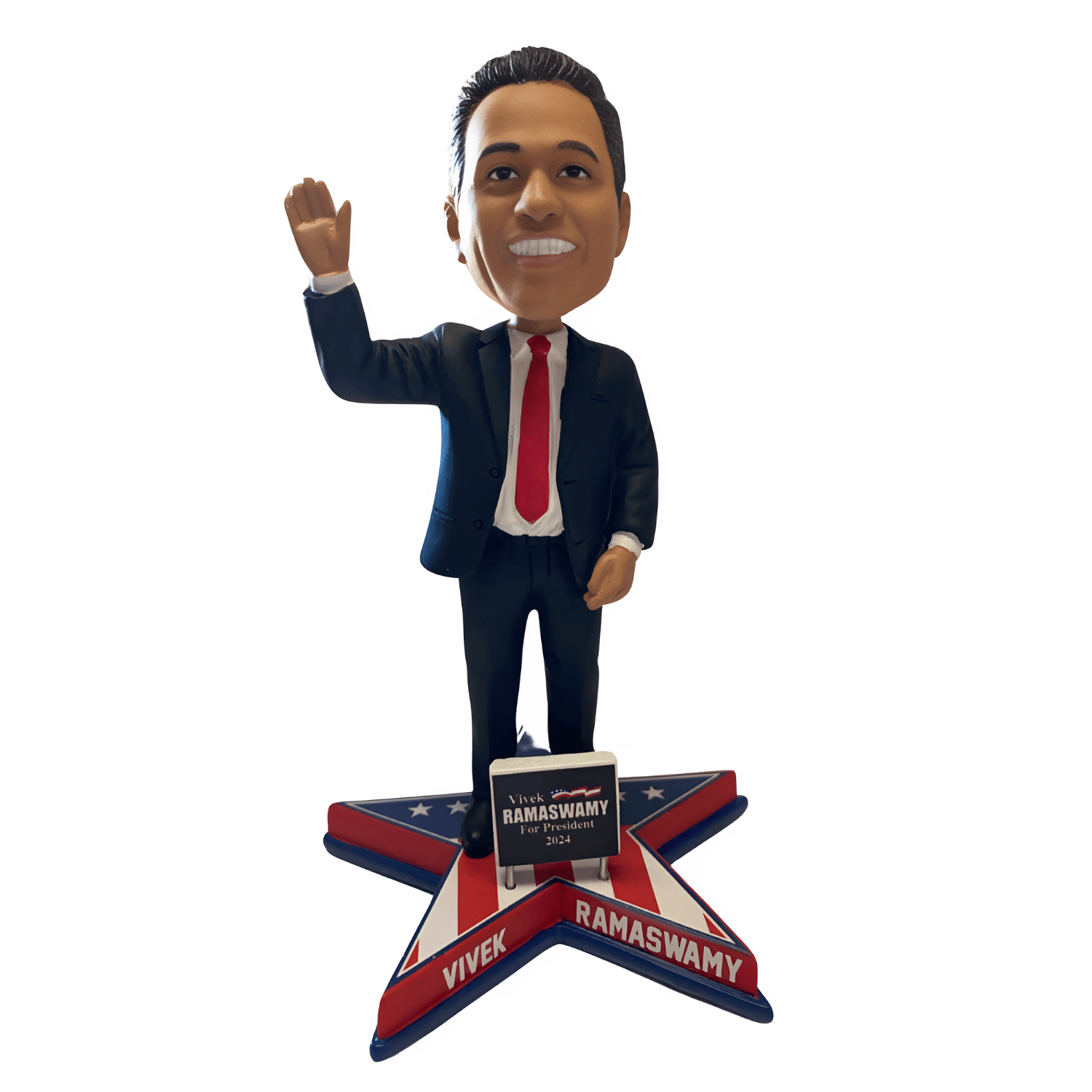 Vivek Ramaswamy Bobble Head in a sharp suit with a red tie, featuring a patriotic base and miniature podium, ideal for display.