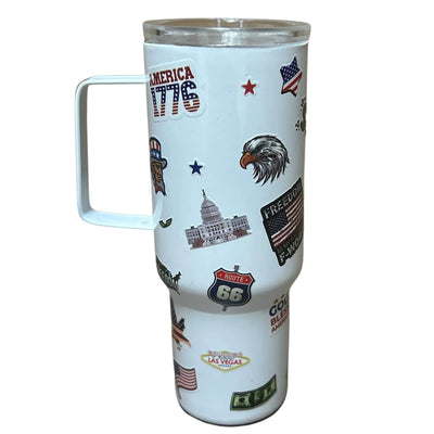 White Patriotic Mini Tumbler featuring vibrant American flag, eagle, and star designs, held in hand against a festive backdrop.