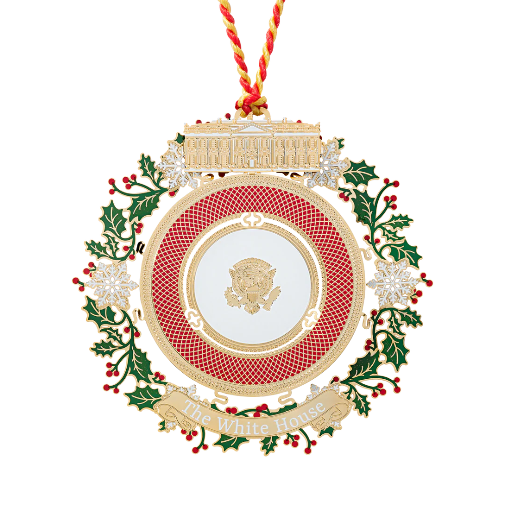 Elegant 2025 Presidential China Ornament — 3" brass collectible finished in 24K gold, featuring a detailed china plate design with holly and snowflake accents, presented in a keepsake gift box.