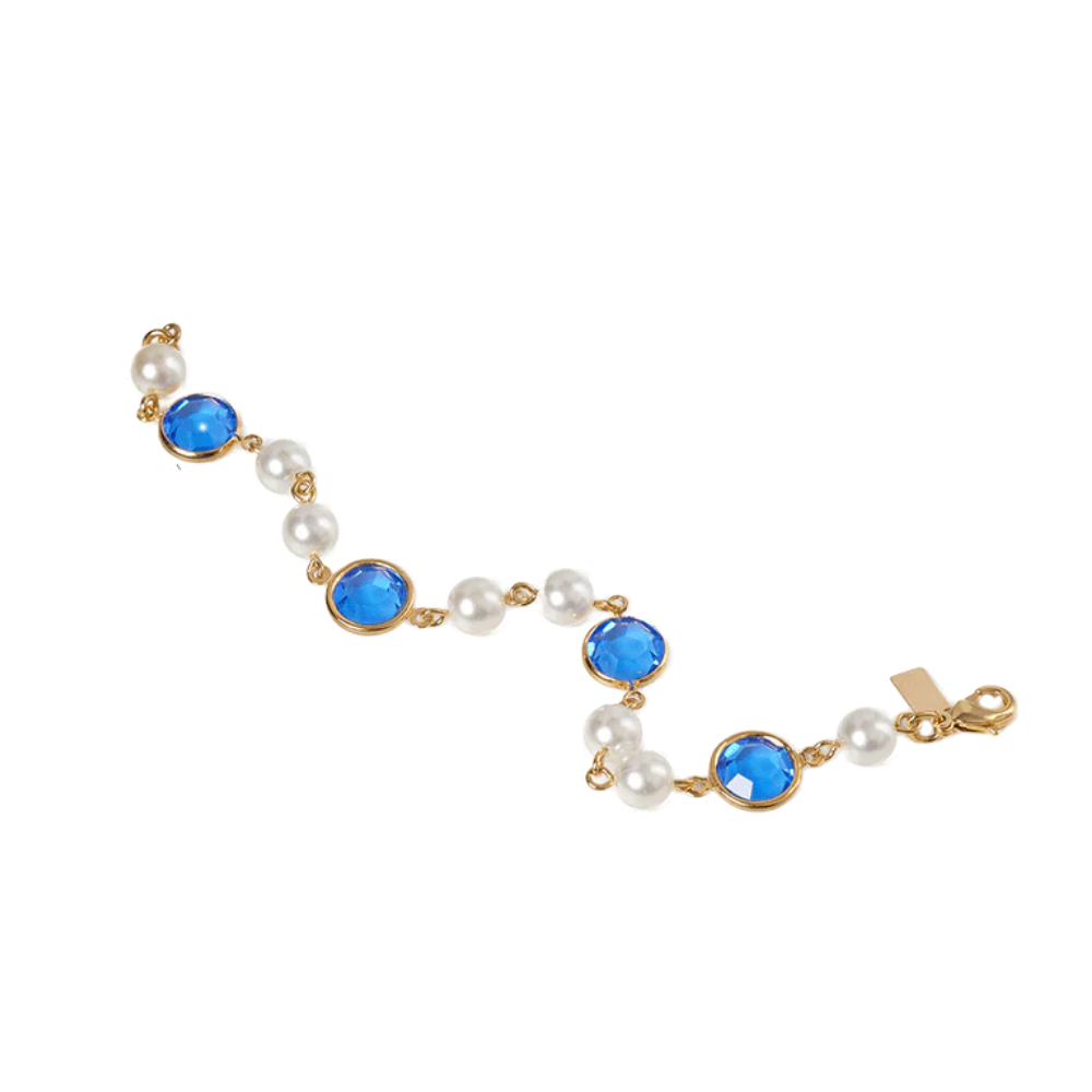 A fashion-pearl bracelet with gold-tone spacers, inspired by Jacqueline Kennedy and the White House Blue Room — elegant, versatile, and comfortably designed.