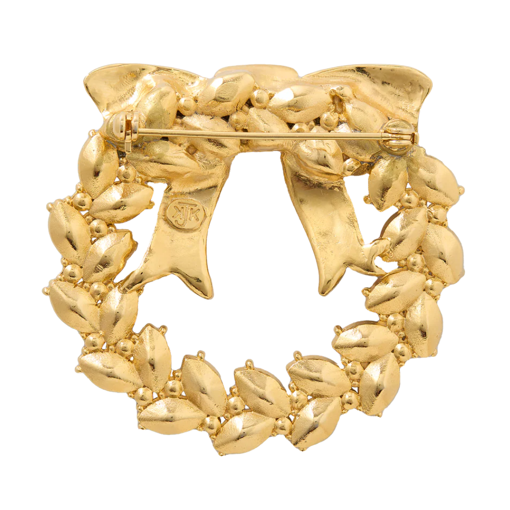 A 2.1-inch gold-plated pewter wreath brooch inspired by White House Christmas décor — a timeless, patriotic accessory that brings holiday spirit to your outfit.