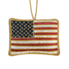 A felt ornament of the U.S. flag with gold stitching and “UNITED WE STAND” embroidered on the back — a simple, patriotic keepsake for holiday decor or year-round display.